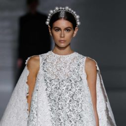 Haute Couture SS19; Kaia Gerber on Givenchy runway SS19 with brown hair in smooth low bun with jewelled tiara headband.