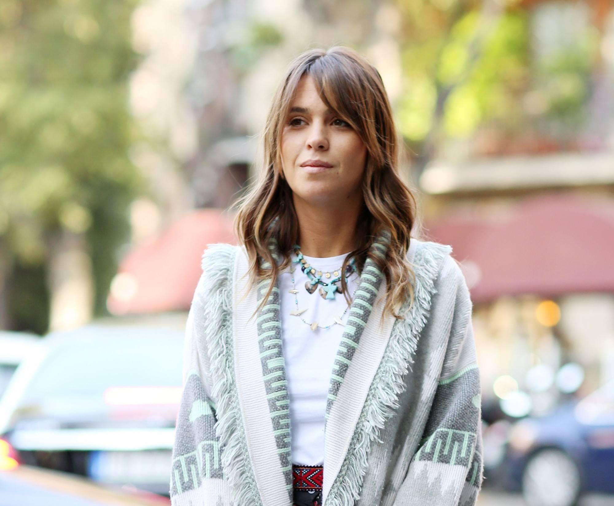 Haircuts for thick hair: Brunette street styler with shoulder length wavy curls and a split fringe