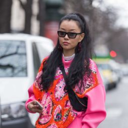 Paris Fashion Week Street Style: Woman with long brown hair in half-up, half-down ponytail wearing sunglasses