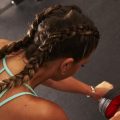 close up of a woman boxer braids in the gym