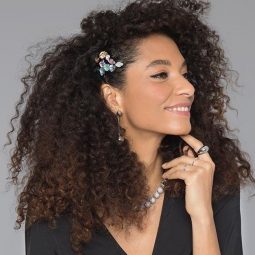 Woman with naturally curly hair with hair accessories