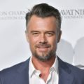 Hairstyles for men over 40: Photo of Josh Duhamel with dark grey side parted brush back hair