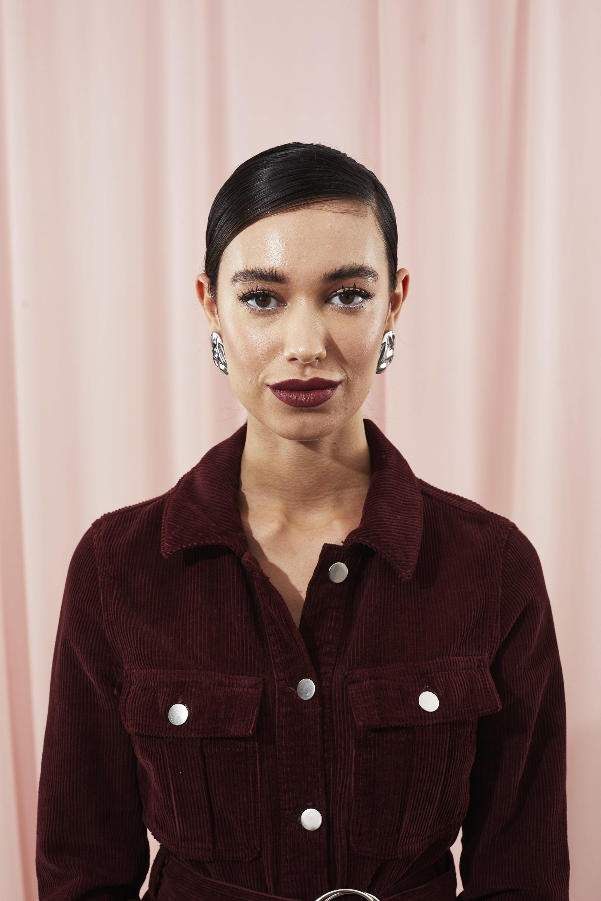 Woman with sleek ponytail hairstyle