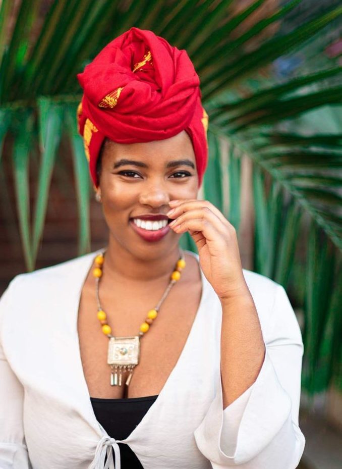The Day I Went Natural: Shot of Dr. Alexandra Oti wearing a headwrap and posing outside