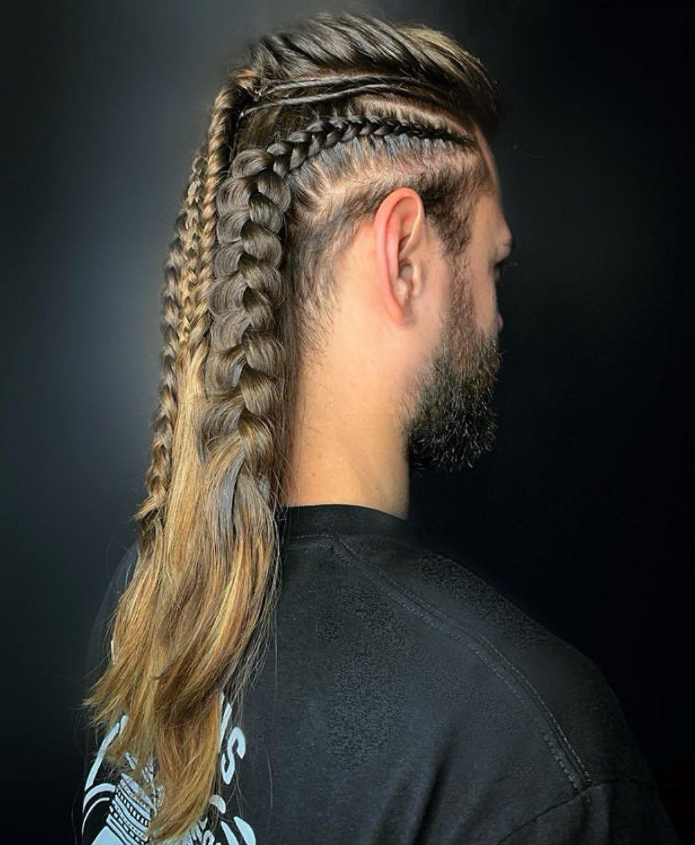Brown haired man with a braided hair design