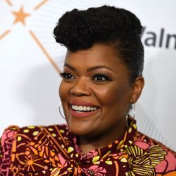 Actress Yvette Nicole Brown with natural hair in pompadour updo.