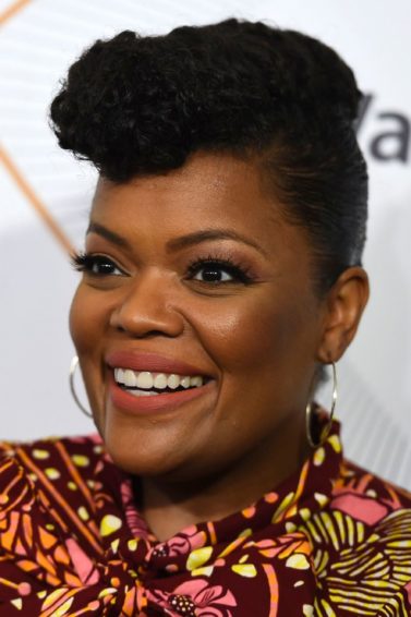 Actress Yvette Nicole Brown with natural hair in pompadour updo.