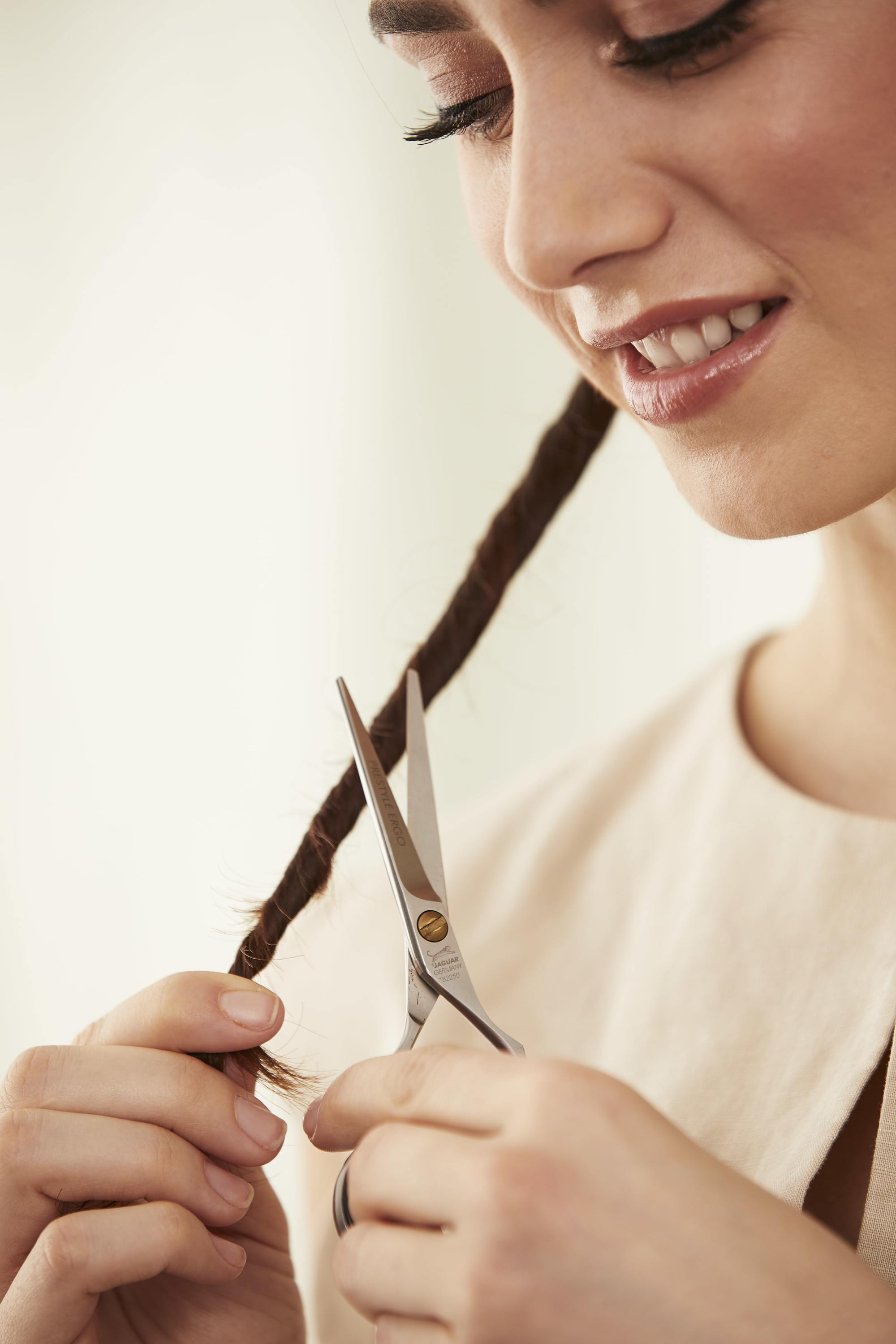 Woman following the hair dusting method to cut split ends
