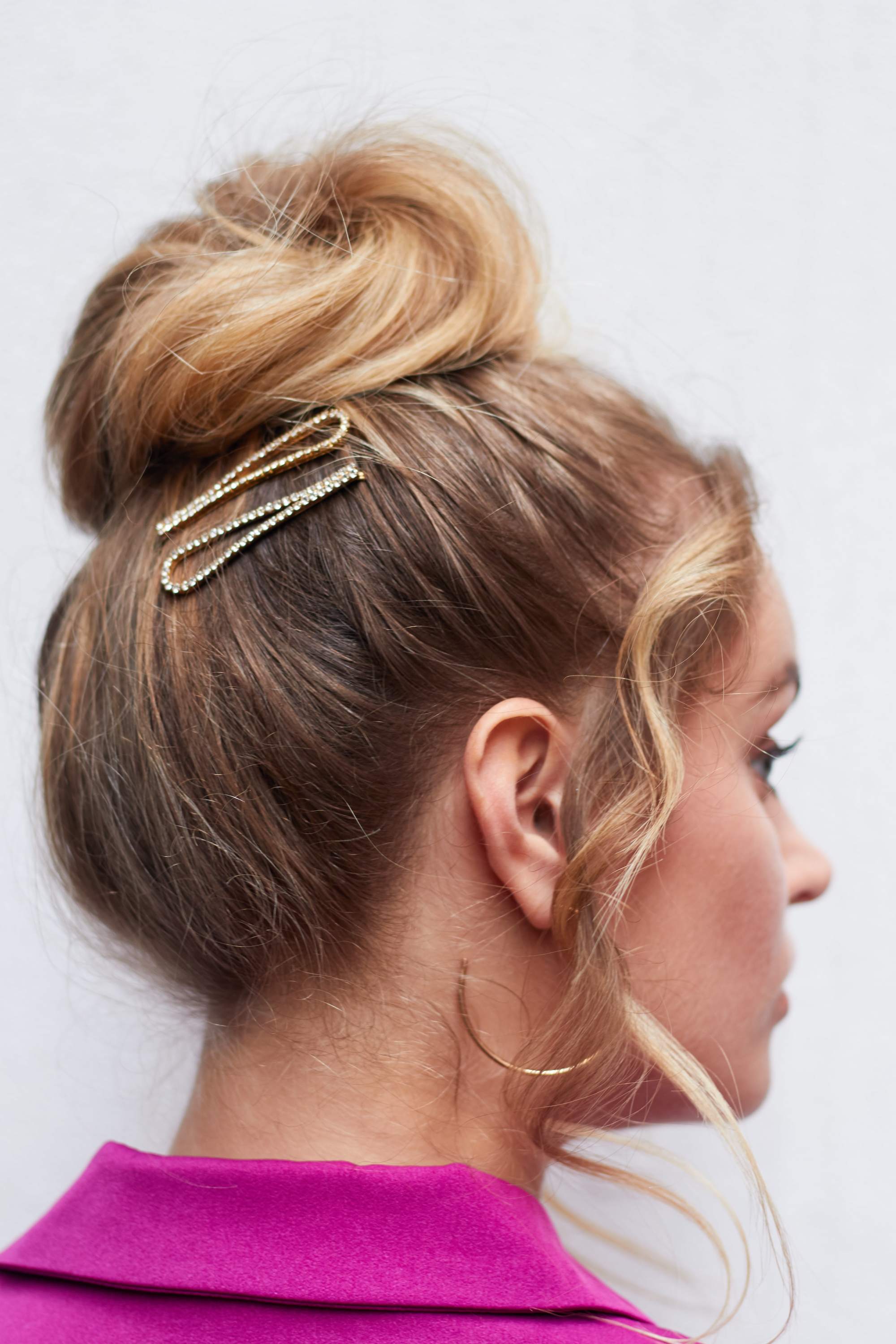Bridesmaid hairstyles: Woman with ballerina bun updo