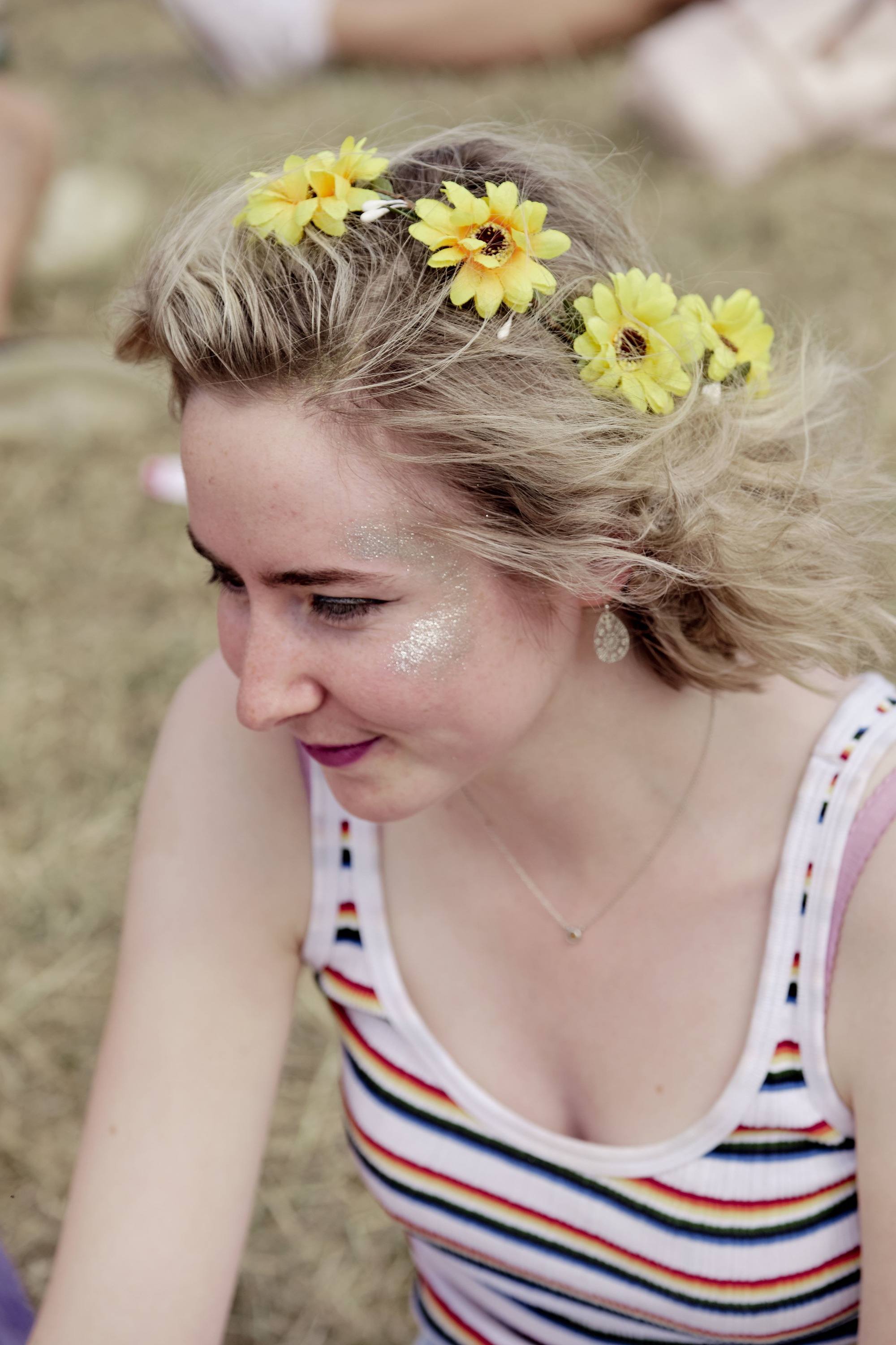 blonde woman with daisy floral accessories