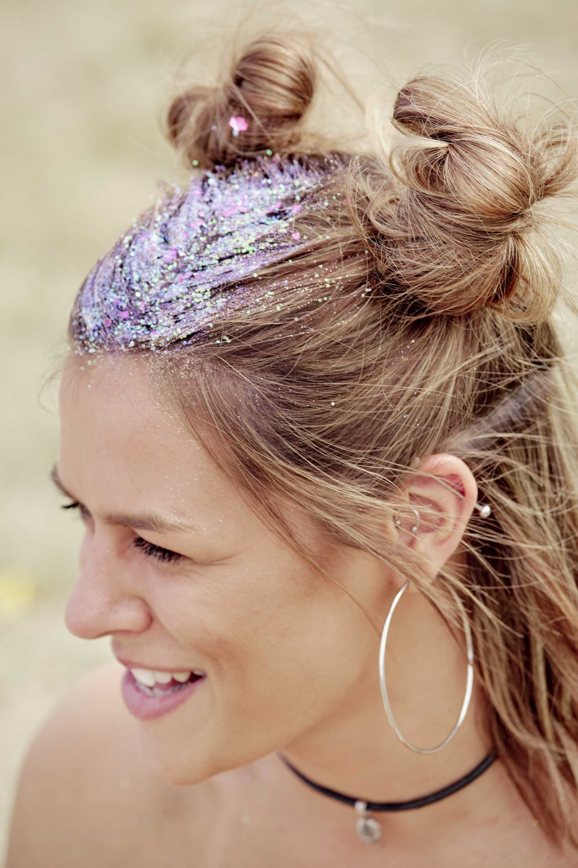 Brown blonde woman with glitter in her half-up buns