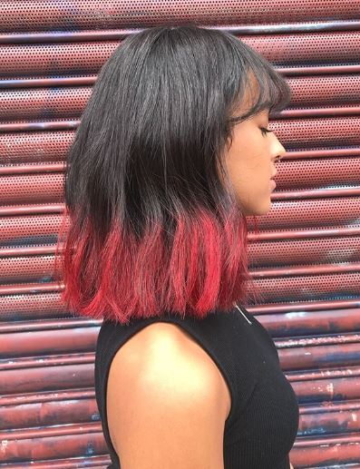 Woman with black and red ombre long bob
