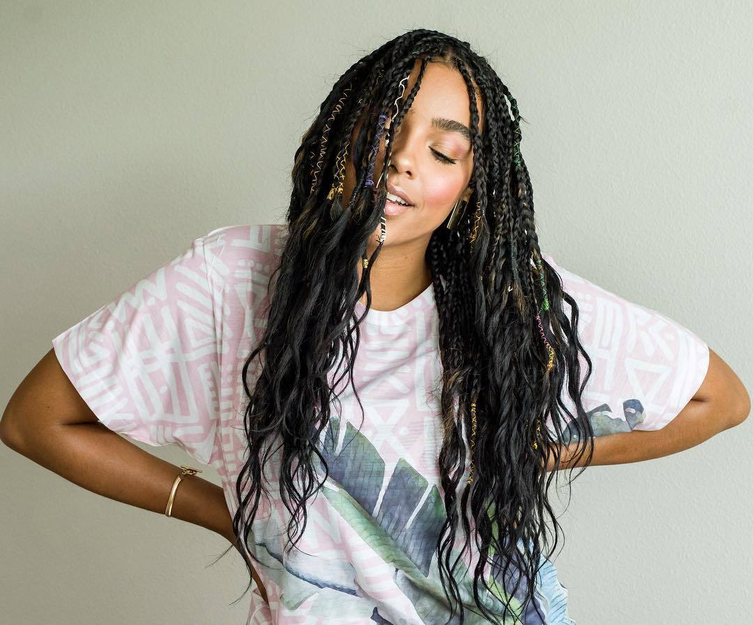 woman with long dark brown boho braids