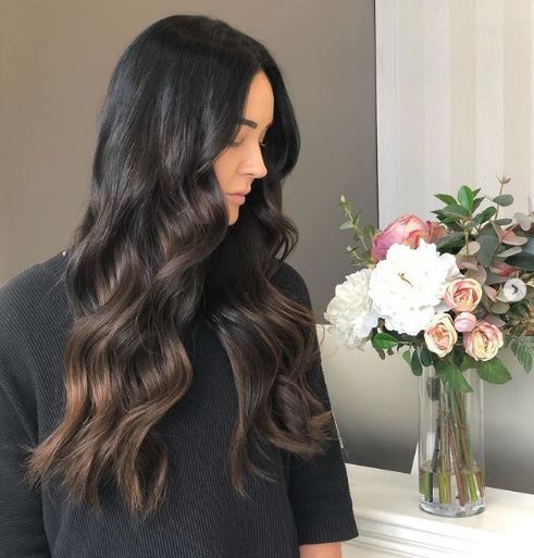 Woman with dark brown black ombre hair