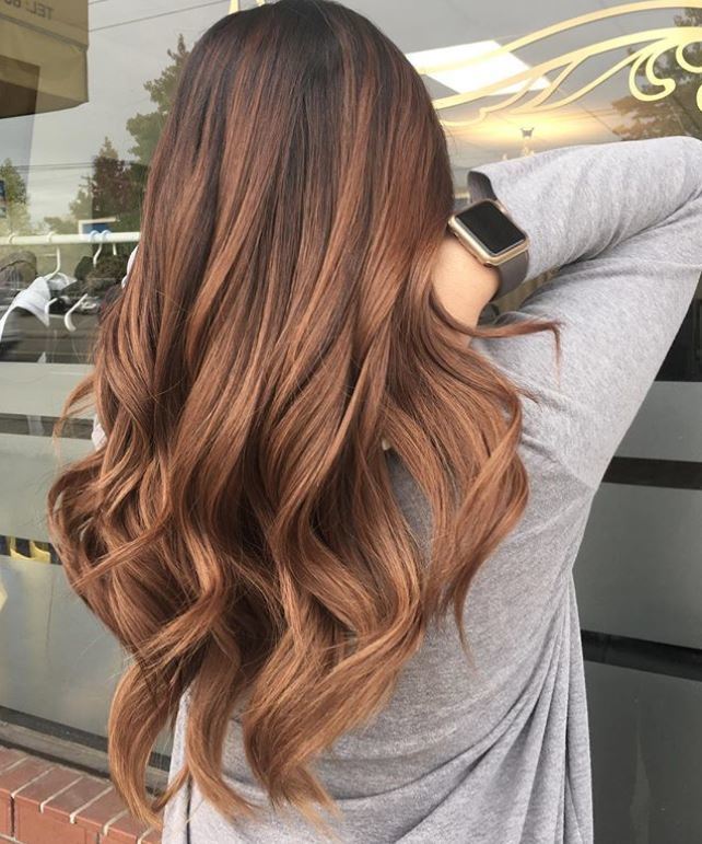 Woman with long wavy brown ombre