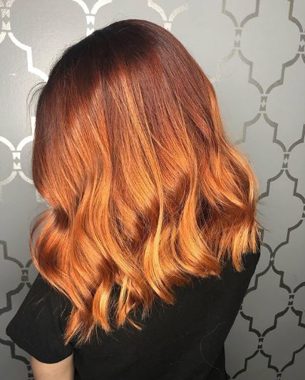 Woman with copper ombre wavy hair