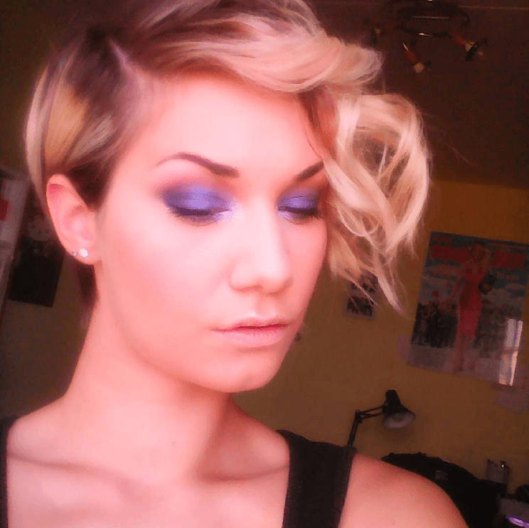 Woman with blonde asymmetrical pixie