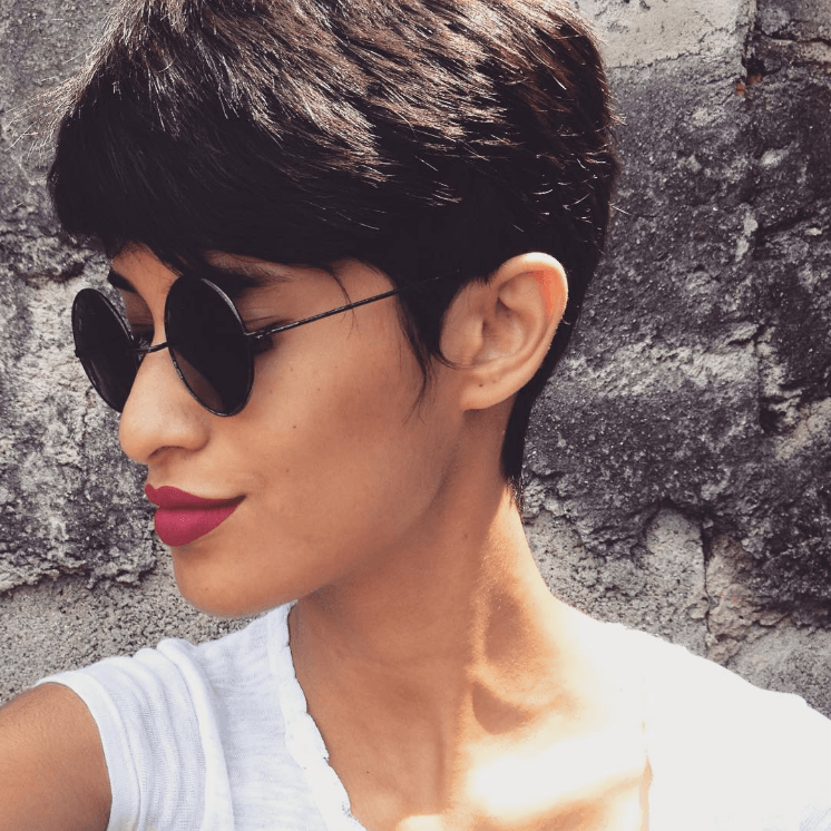 Woman with brown straight hair pixie cut