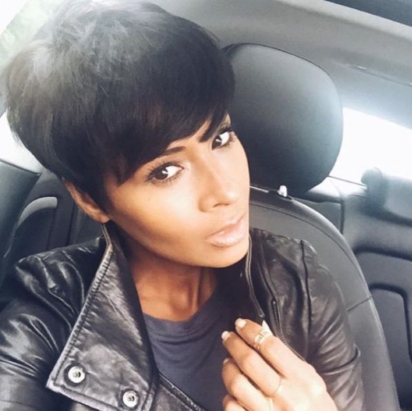 Woman with straight dark brown long pixie cut