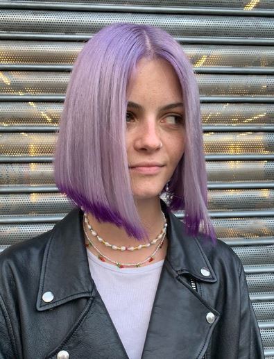Woman with straight lilac ombre bob