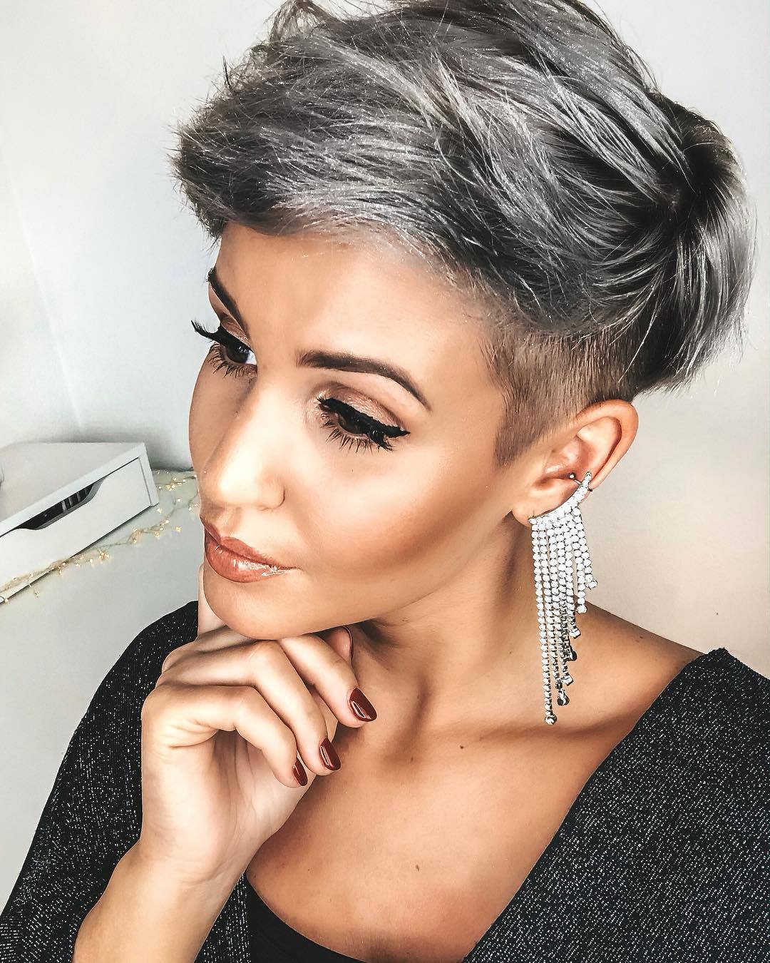 woman with grey silver pixie cut