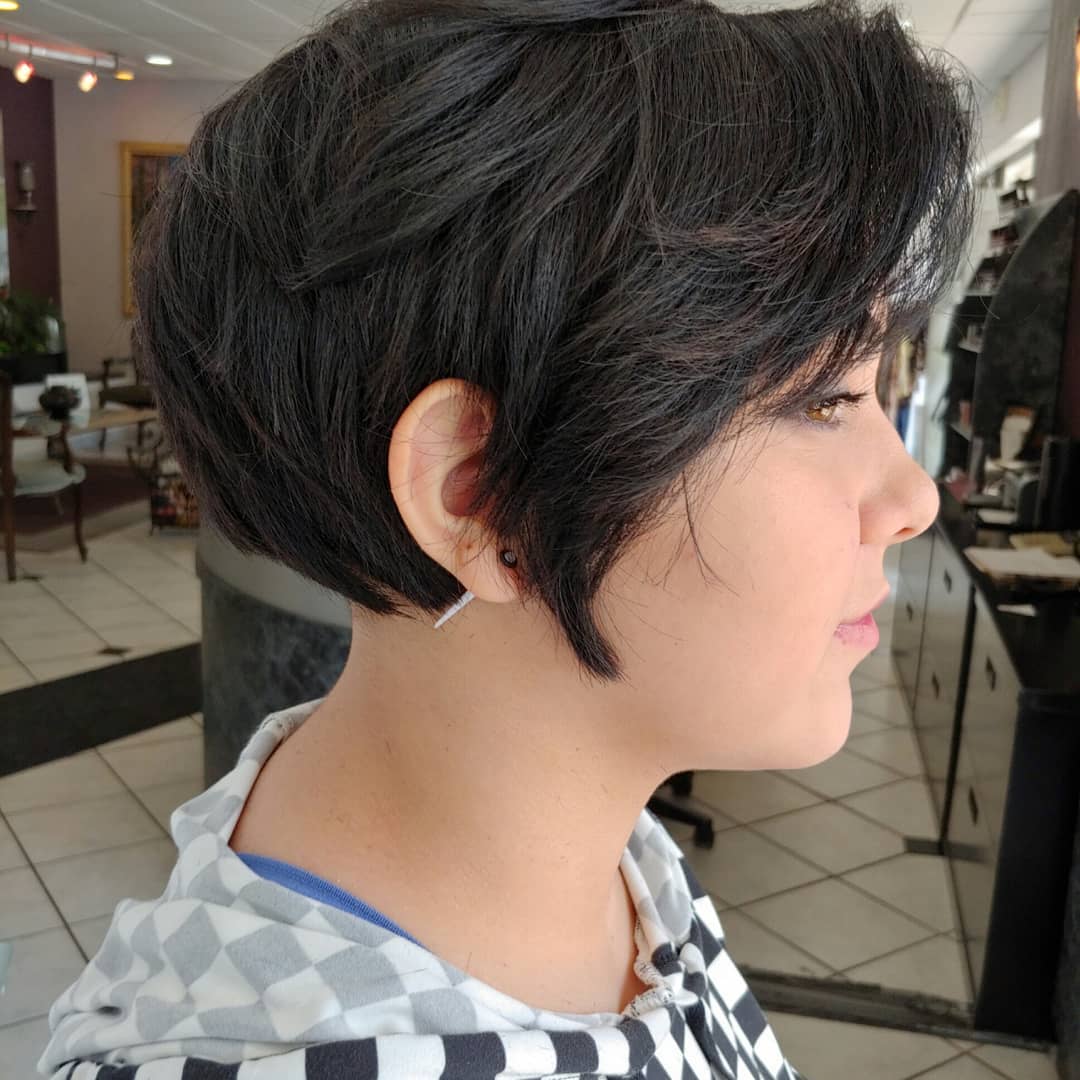 woman with layered dark brown pixie haircut