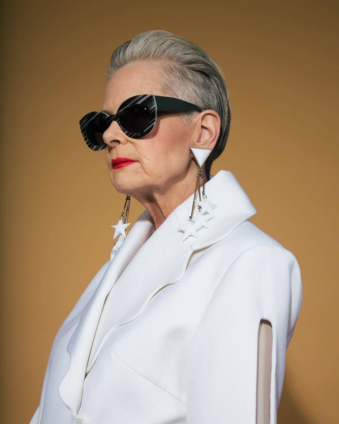 older woman with swept back hairstyle