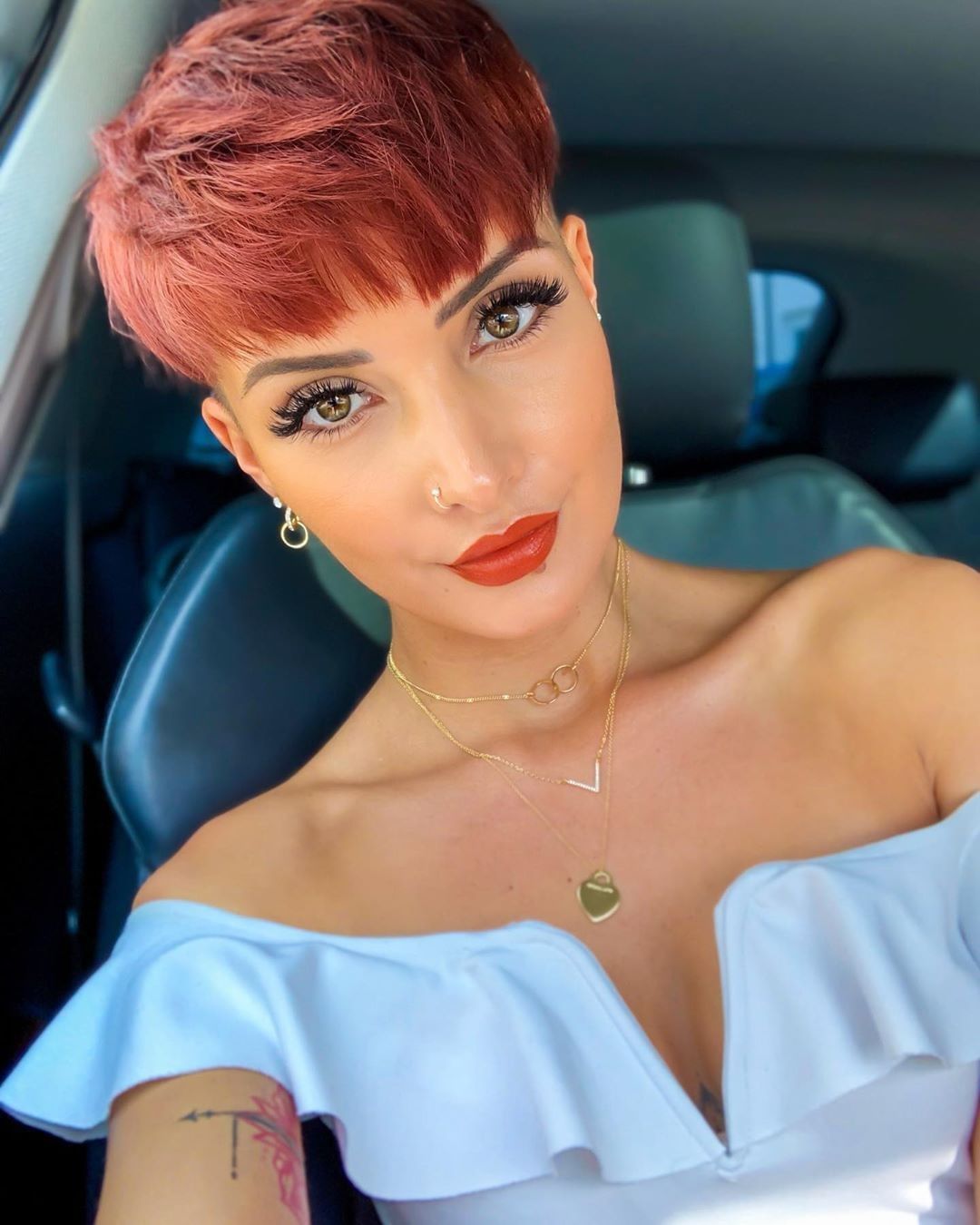 woman with red bowl cut pixie cut