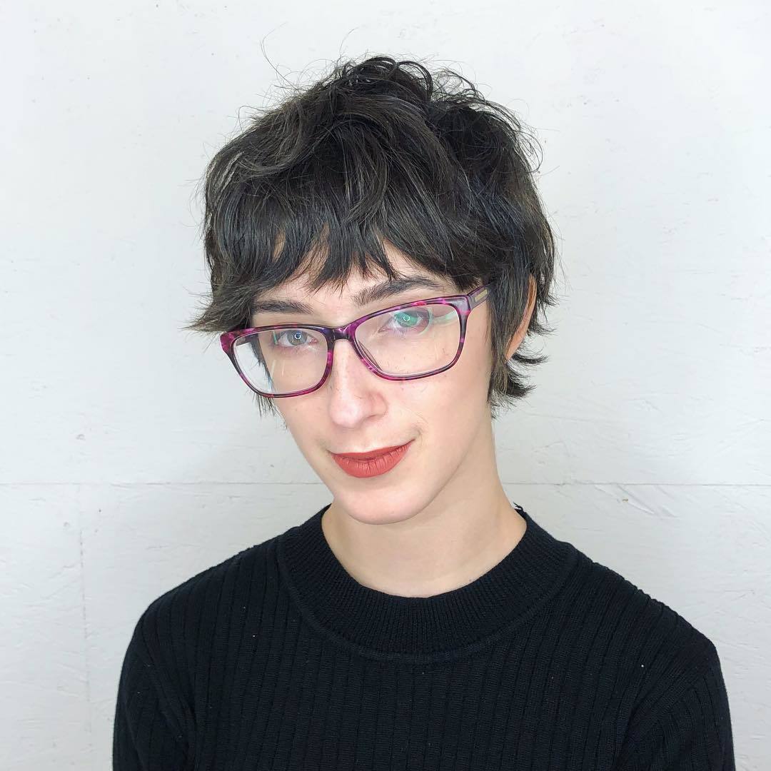 woman with dark brown shaggy pixie haircut