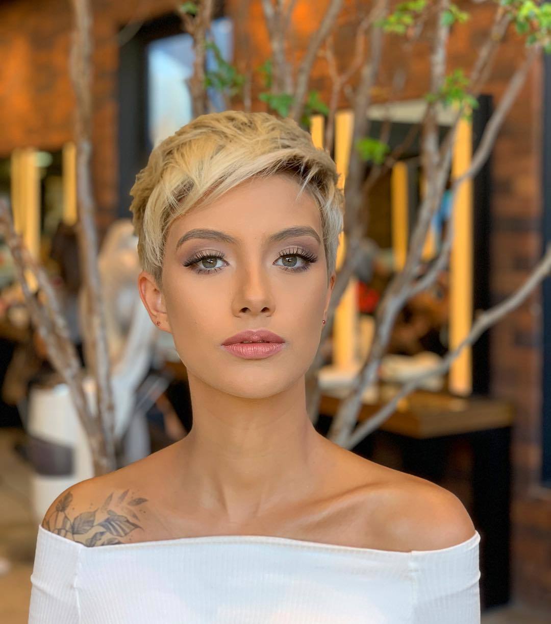 woman with short blonde pixie cut hairstyle