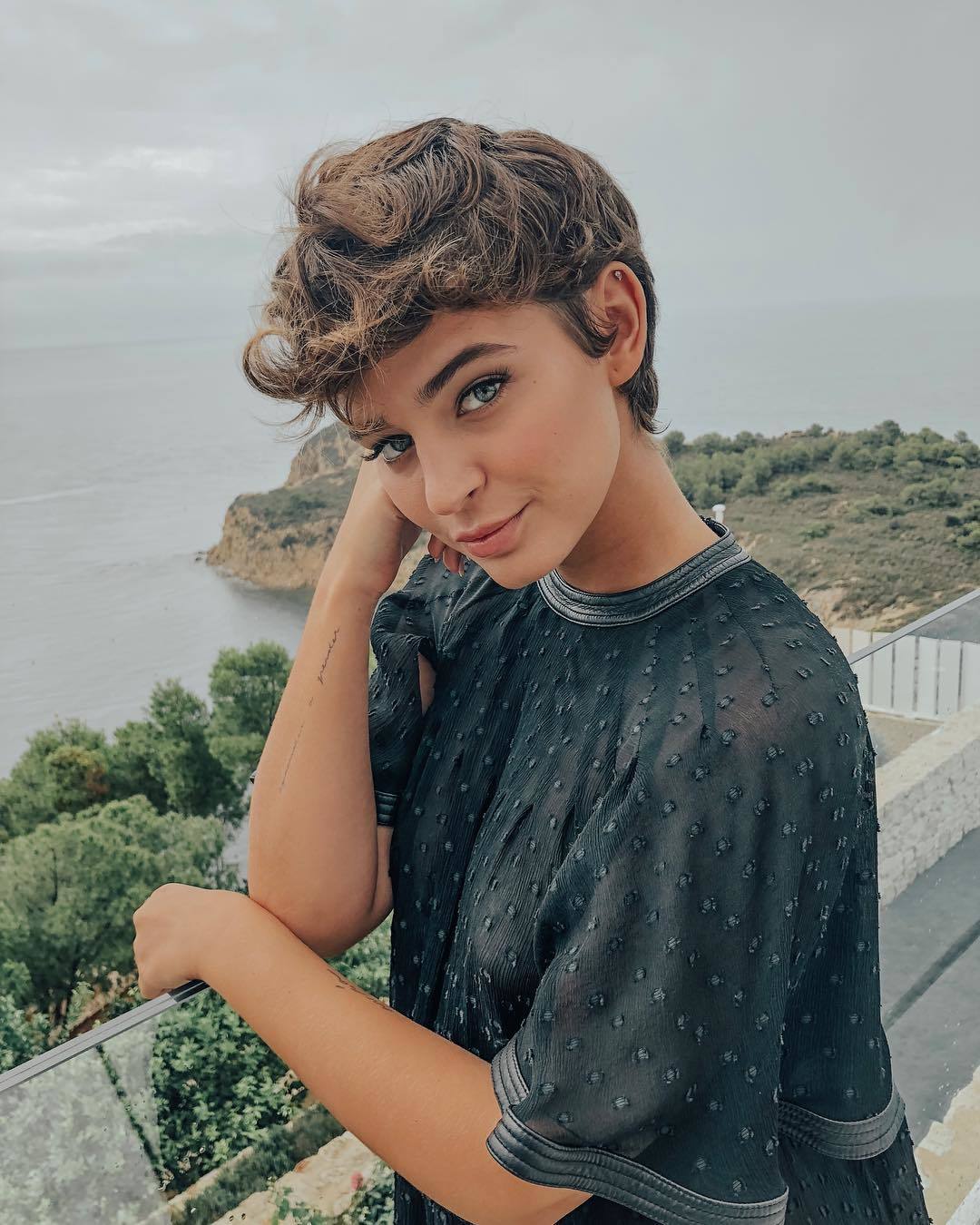 woman with thick medium brown pixie cut