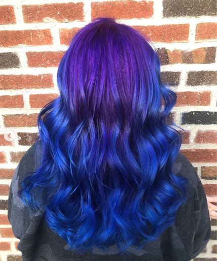 woman with purple and blue wavy ombre hair