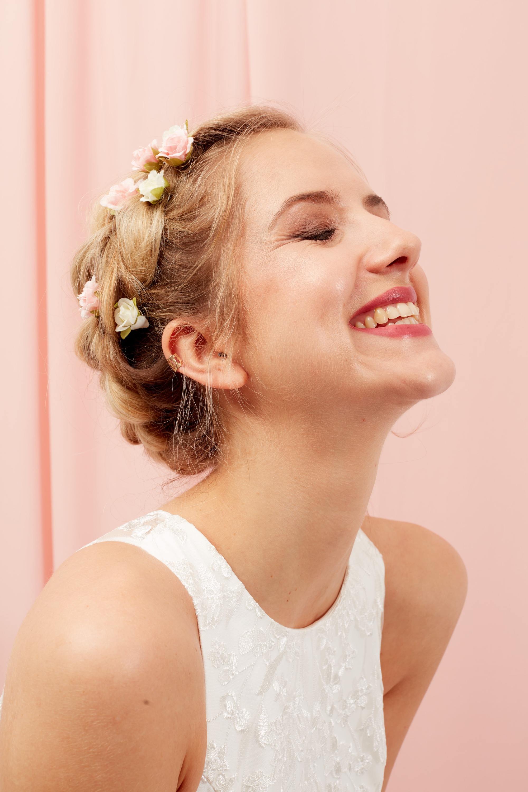 Blonde woman wit halo braid and flowers