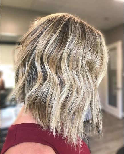Woman with wavy blonde bob