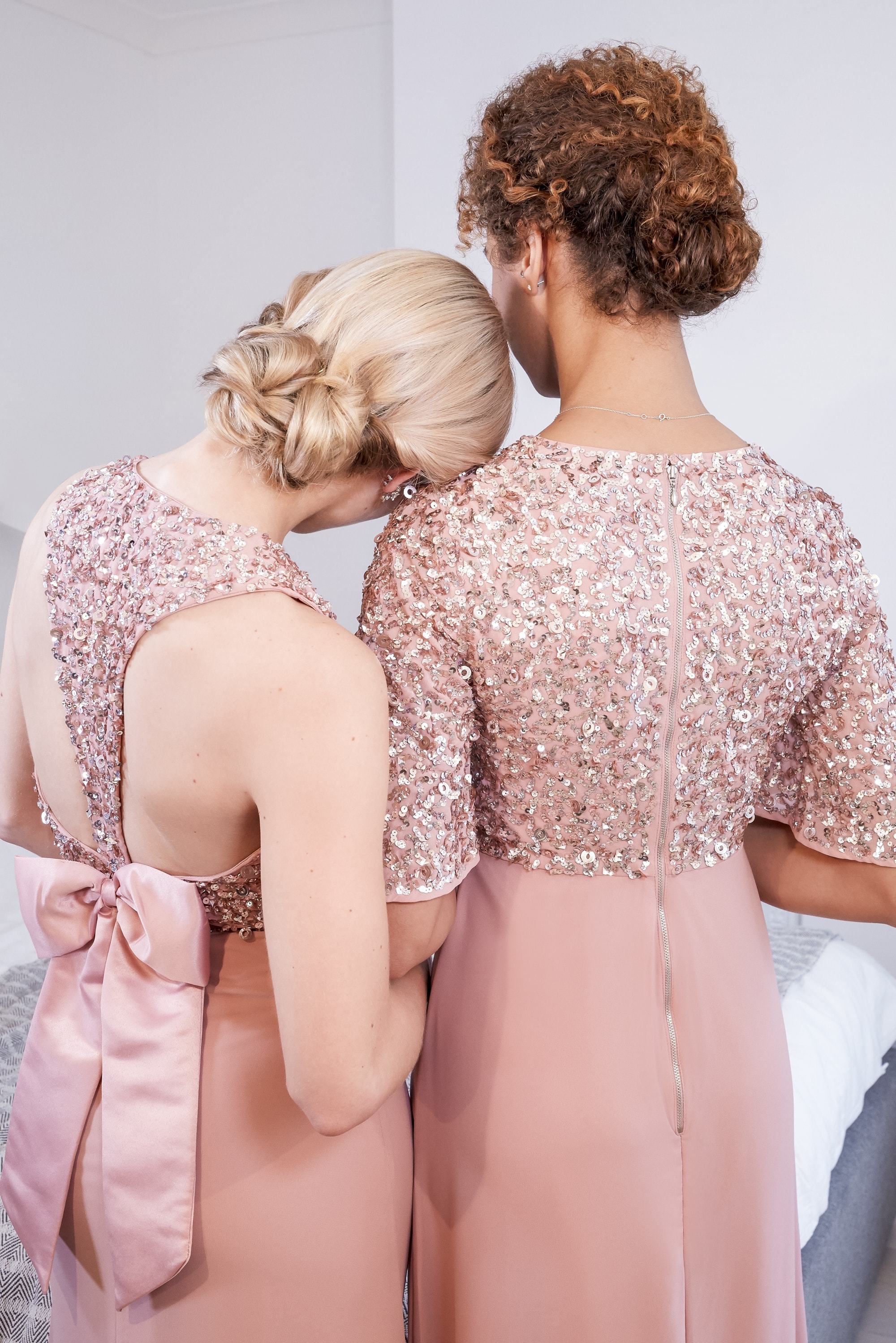 Two woman with hair in chignon