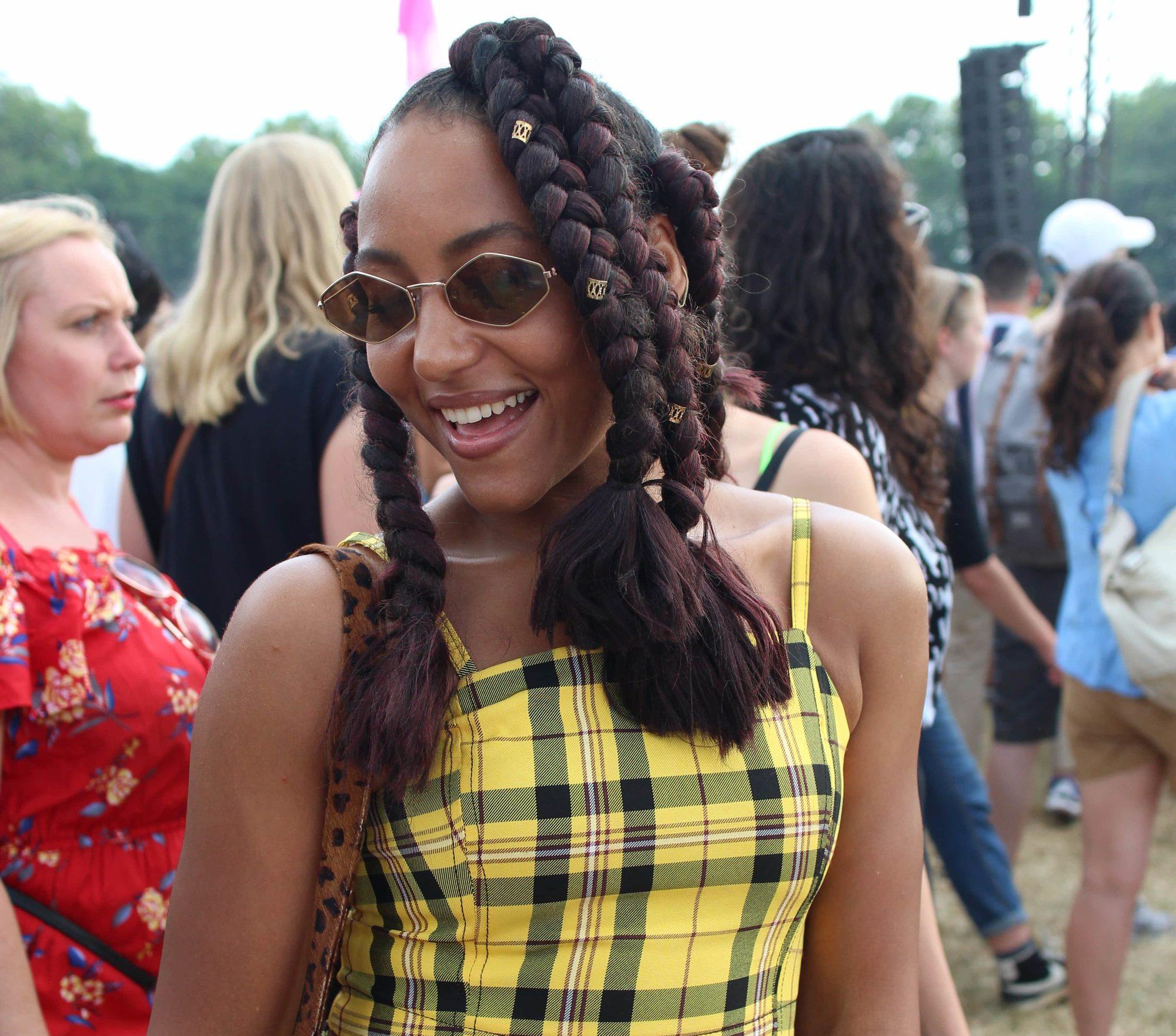 Woman with dark red oversized dookie braids