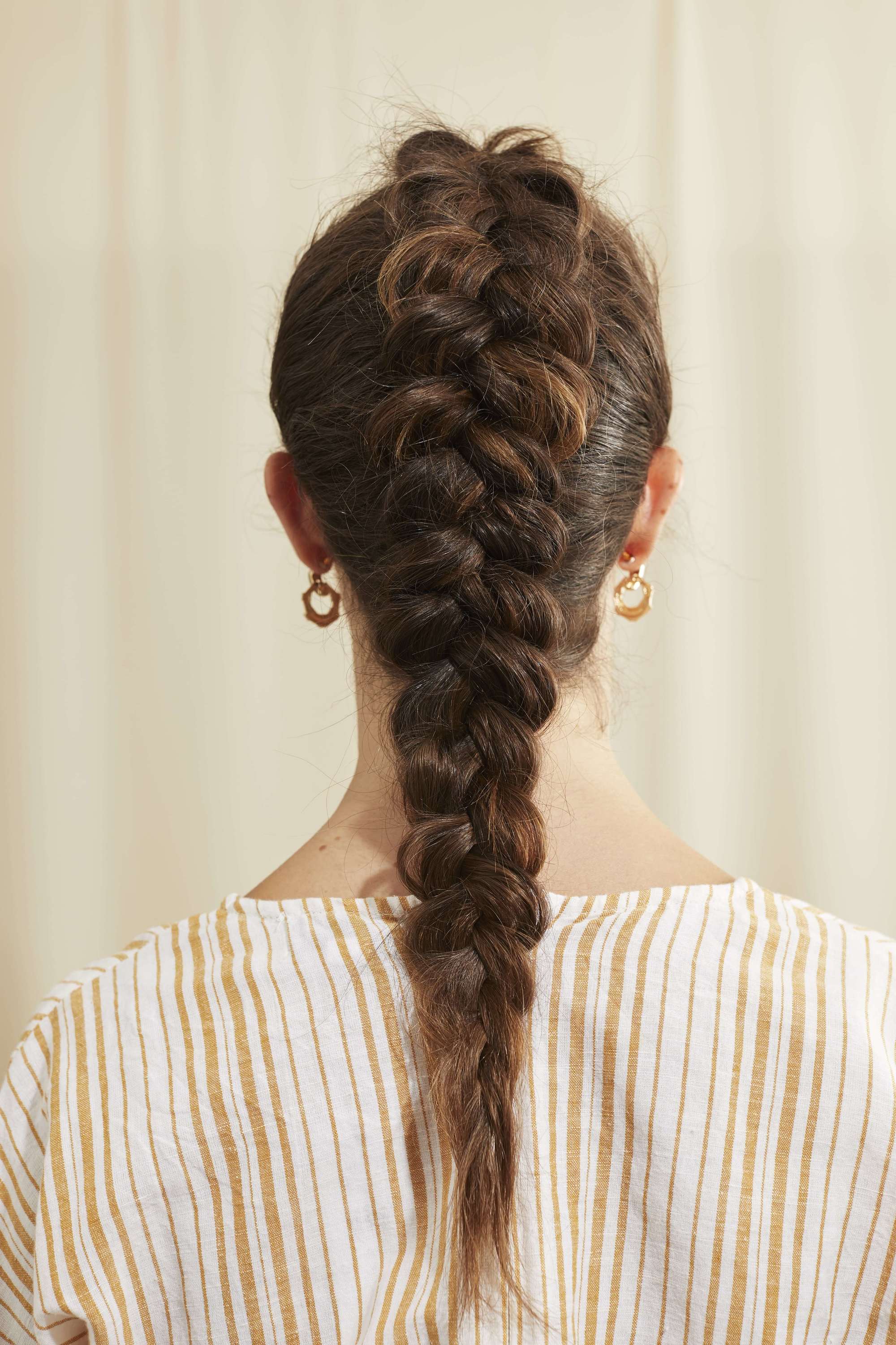 Dutch braid on long brown hair