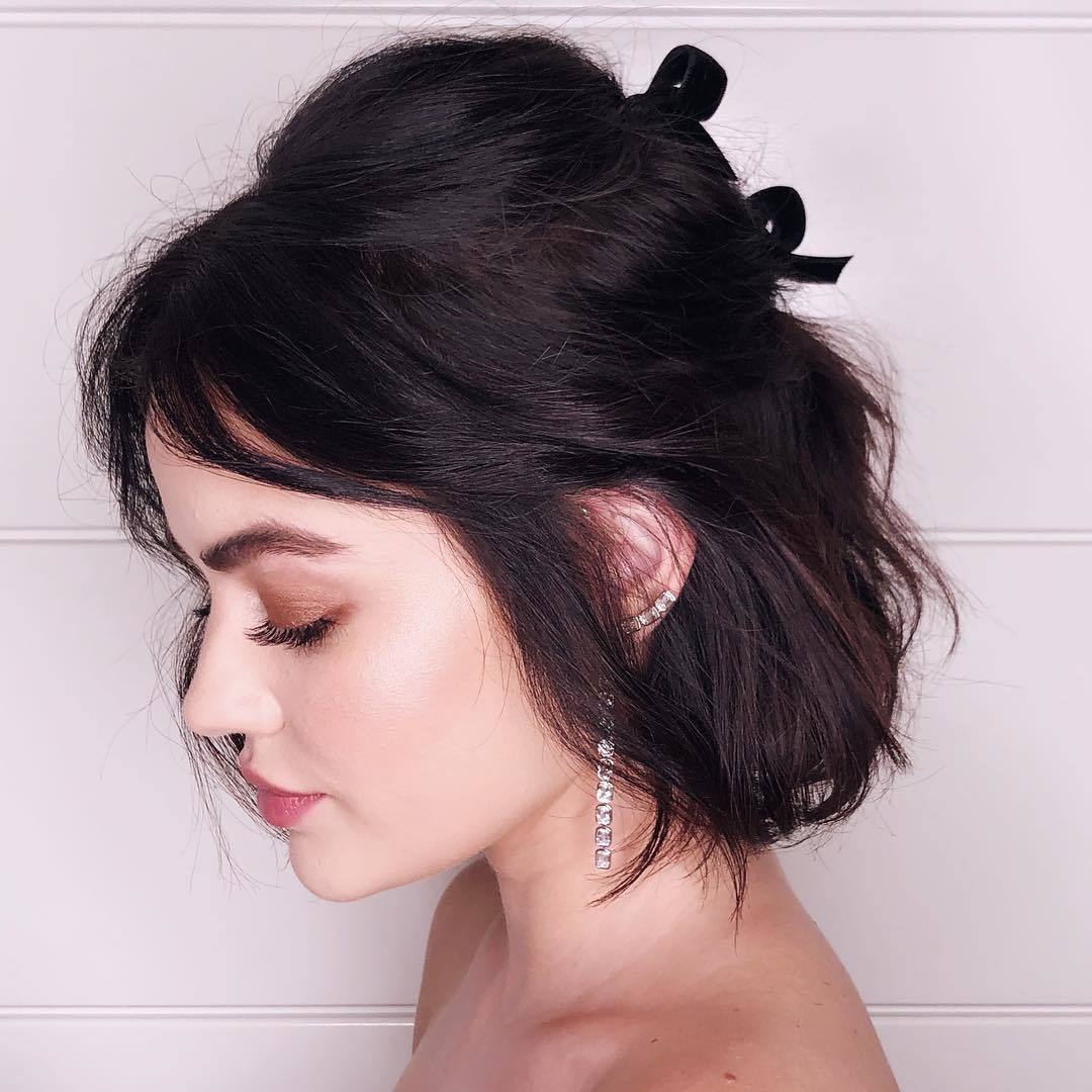 Lucy Hsle with half-up wavy bob
