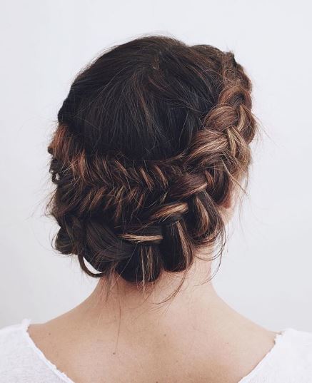 Brunette woman with fishtail halo braid