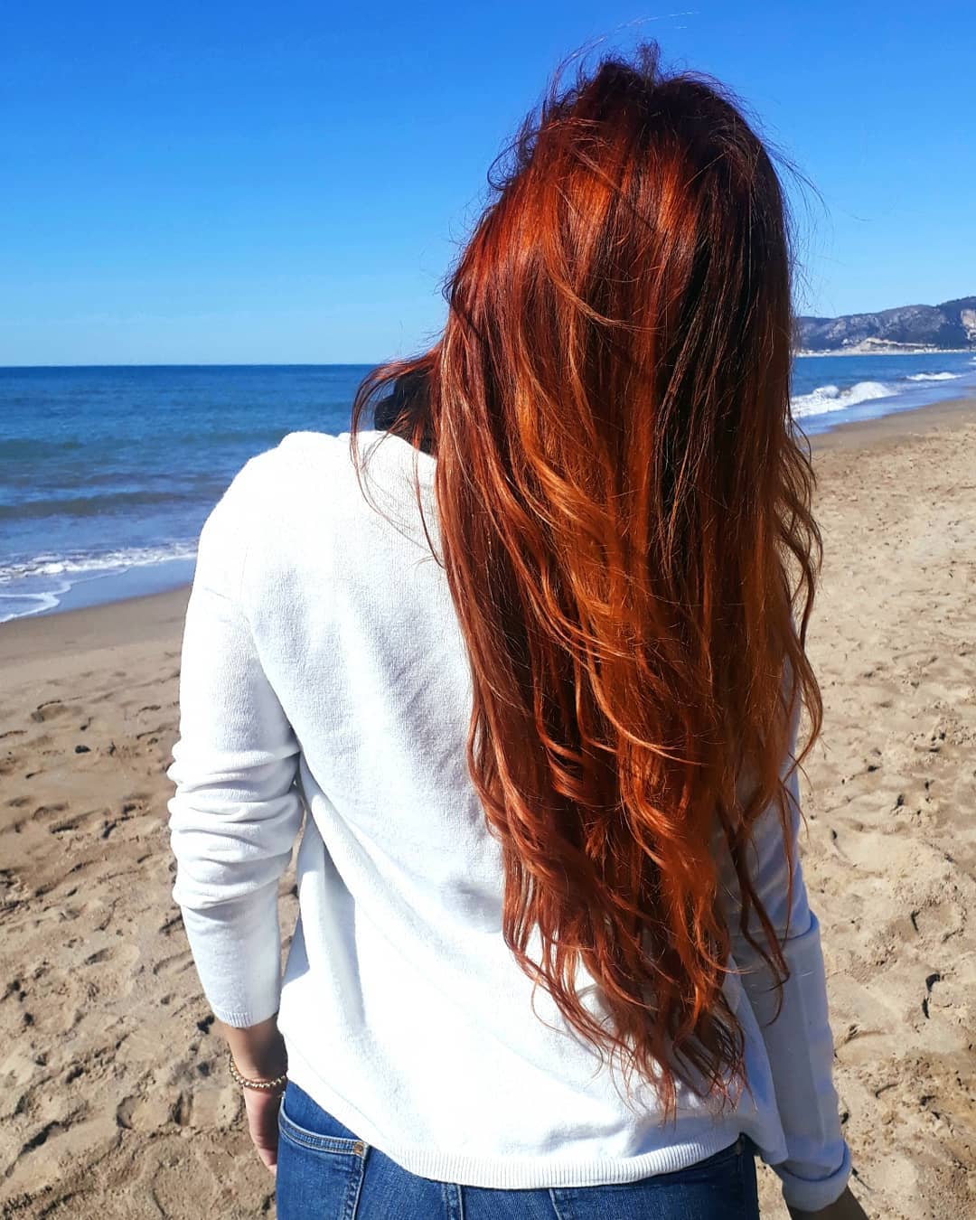 woman with long henna dyed red hair