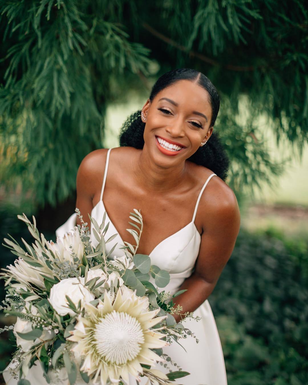 Bride with natural low sleek ponytail hairstyle