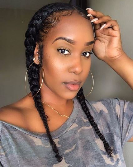 Woman with two cornrow braids