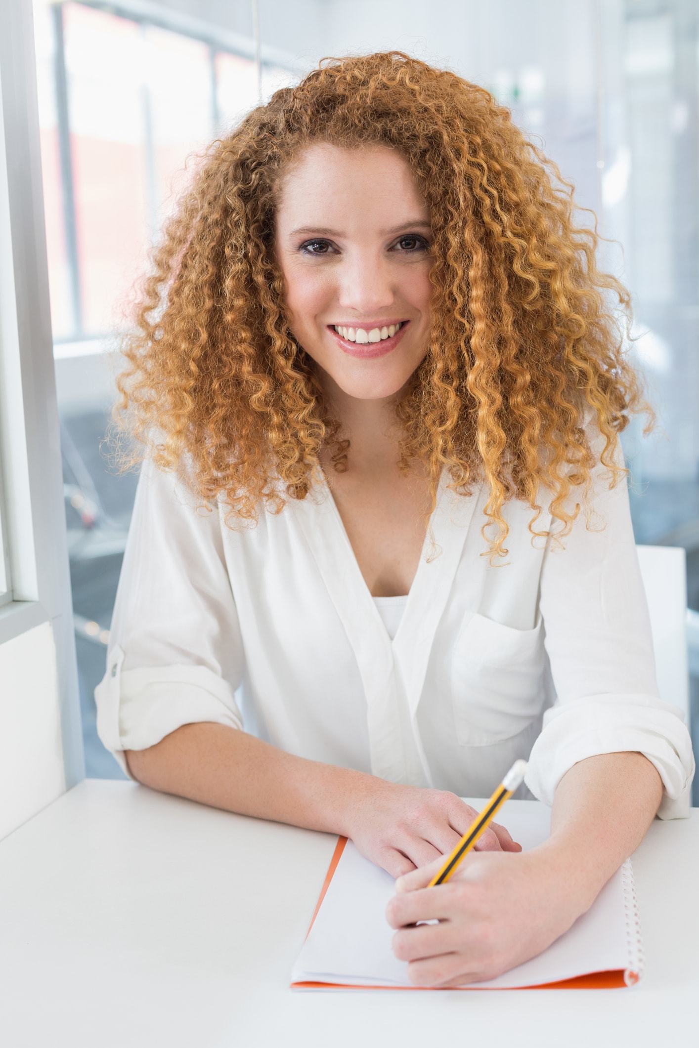 woman with spiral perm blonde hair