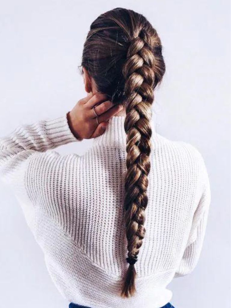 Woman with dark long hair braided