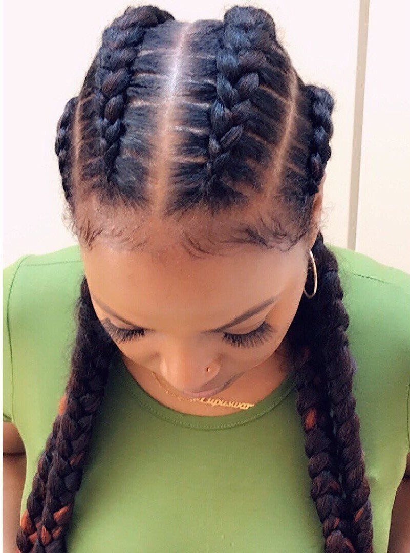 Woman with 4 cornrow braids