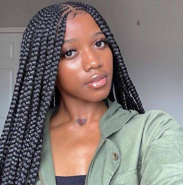 Woman with long layered cornrows