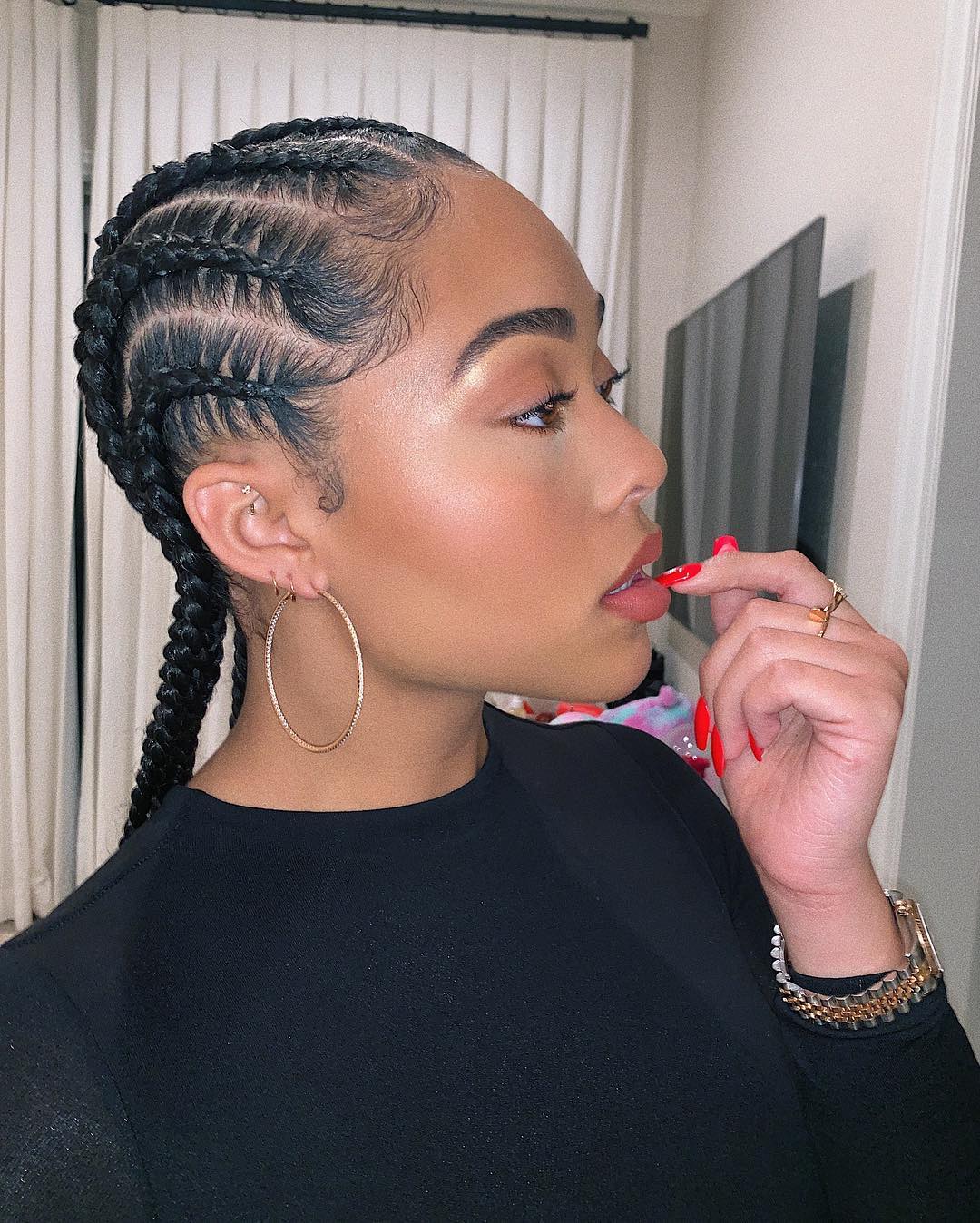 Jordyn Woods with dark and long cornrow plaits