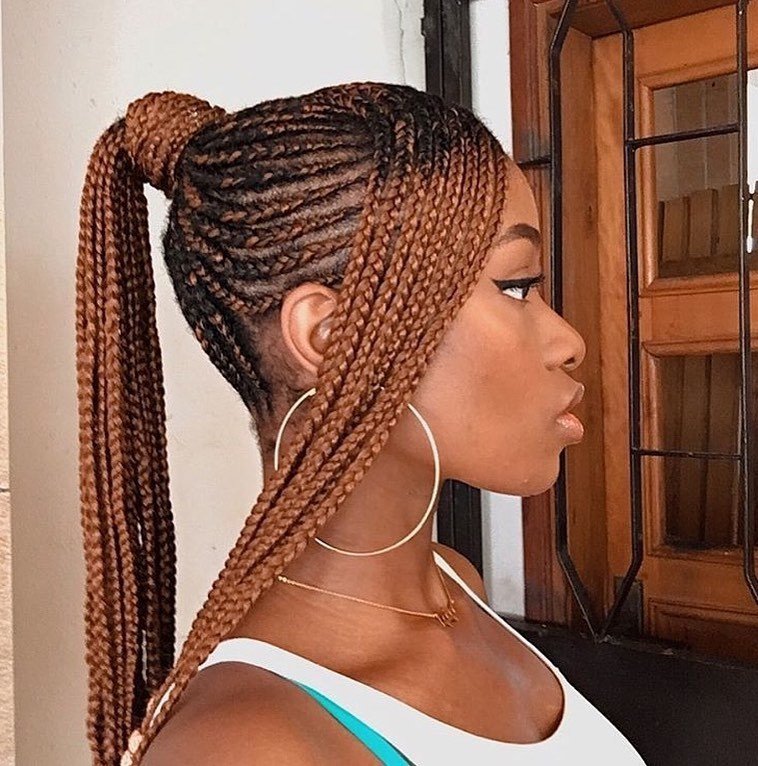 Woman with cornrow ponytail with side bangs