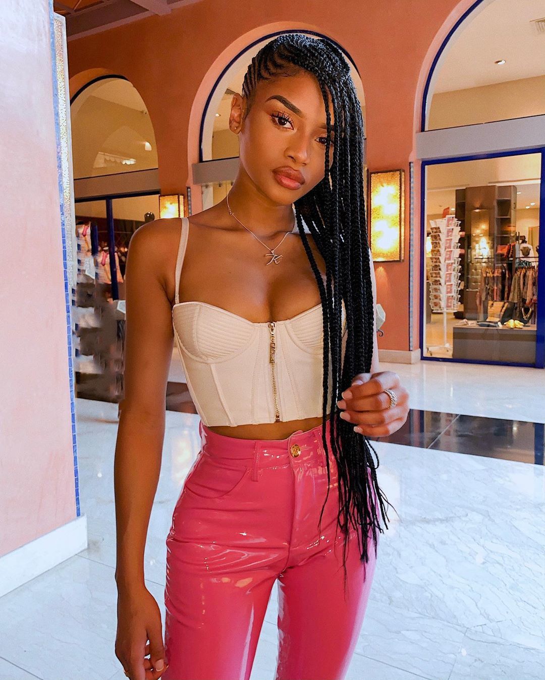 Woman with hip length cornrows