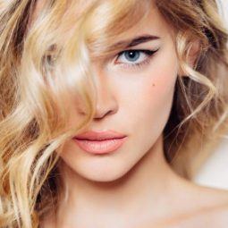 blonde woman with side swept wavy 2b hair